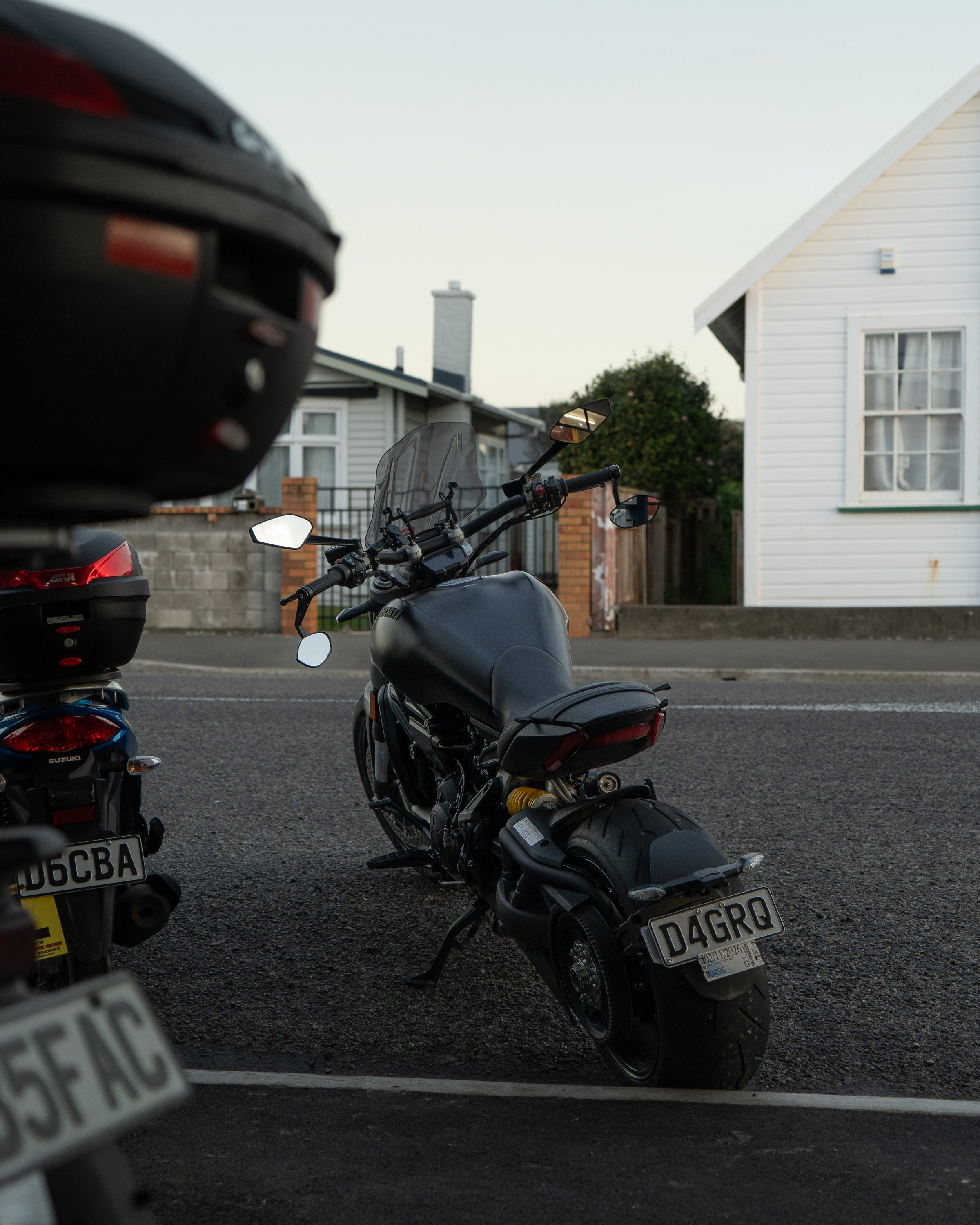 Motorcycle parked on a Wellington street at dusk, shot on location for Miramar Mowers.